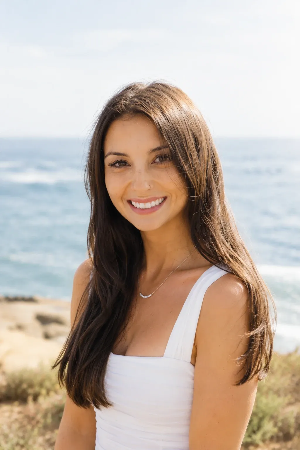Alex Anantiyo smiling on a coastal bluff